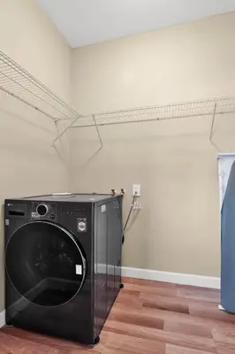 a black washing machine sitting in a room at Home away from home in Hollywood