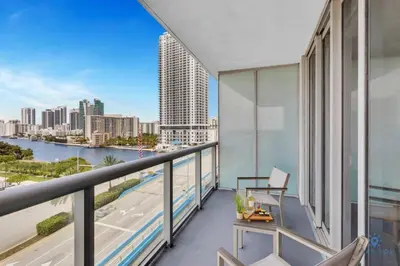 a balcony with a view of a city skyline at Sunset Oasis with 2BR, Balcony, Pool, Perfect Getaway in Hallandale Beach