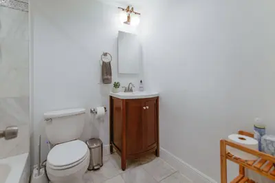 a bathroom with a toilet and a sink at Discover Serenity in this Tranquil Miami Home in Miami