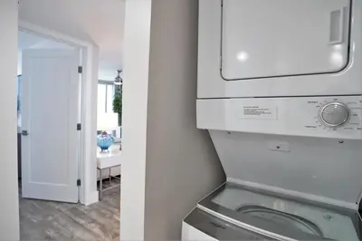 a kitchen with a washer and dryer in a room at Miami Vice! Totally Renovated, Water & Park Views! in Miami