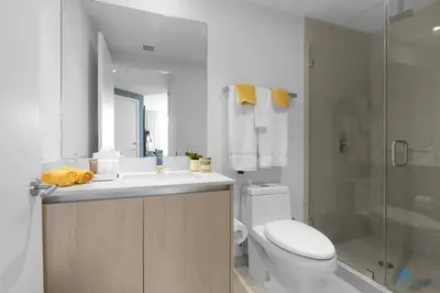 a bathroom with a toilet and a sink and a shower at Wrap Around BalconyParadise Beach Amazing Pools in Hollywood