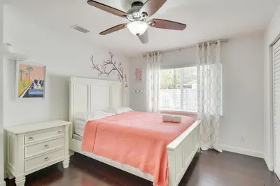 a bedroom with a bed and a ceiling fan at Pet-Friendly Miami Home with Hot Tub and Pool Table in Miami
