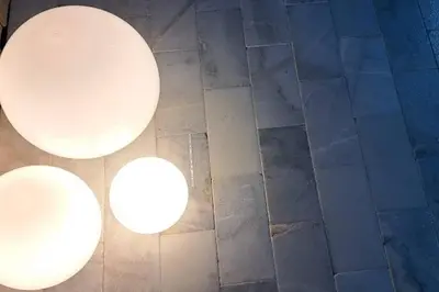 two white lights on the floor of a bathroom at Blue Ocean Vacation Home 2 in Fort Lauderdale