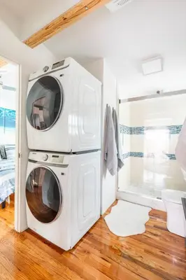 a white laundry room with a washer and dryer at Blue Ocean Vacation Home 2 in Fort Lauderdale