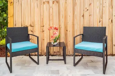 two chairs and a table with a vase of flowers at Blue Ocean Vacation Home 2 in Fort Lauderdale