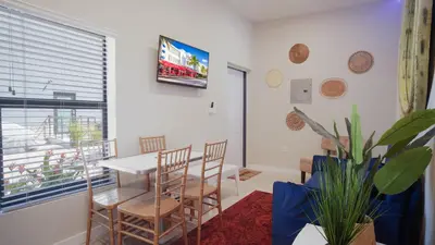 a dining room with a table and chairs and a window at Spectacular Apartment near Brickell in Miami