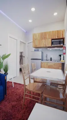 a kitchen and living room with a table and chairs at Spectacular Apartment near Brickell in Miami