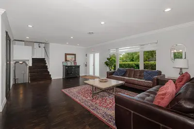 a living room with a couch and a table at Miami Dream Home/ Pool/Jacuzzi/ Fire Pit in Miami