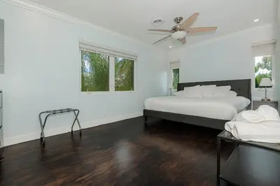 a bedroom with a bed and a ceiling fan at Miami Dream Home/ Pool/Jacuzzi/ Fire Pit in Miami
