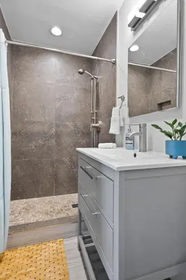 a bathroom with a sink and a shower at Casa Limon - Private Heated Pool Prime Location & Parking in Fort Lauderdale