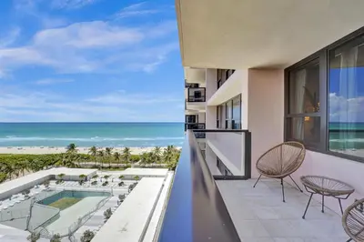 a balcony with a view of the ocean at Breathtaking resort condo w beach service Unit 908 in Miami Beach