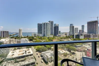 a view of the city from the balcony of a building at High-End Miami Condo with City and Bay Views!!! in Miami