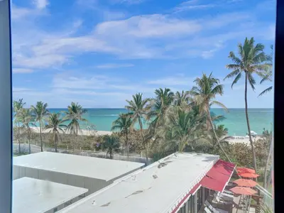 a view of the beach from the balcony of a resort at Oceanfront Haven Retreat Beach Service 502 in Miami Beach
