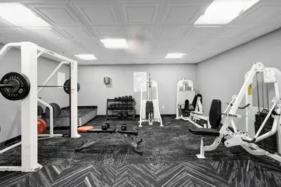 a gym with treadmills and machines in a room at Beachfront Ocean View Condo Beach Service 520 in Miami Beach