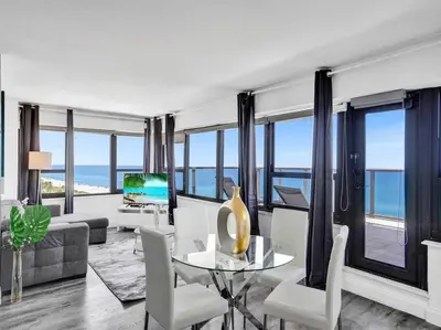 a living room with a view of the ocean at Full ocean view Huge private terrace 1002 in Miami Beach