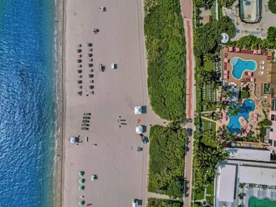 an overhead view of a beach next to the water at Amazing 3BD Ocean View Condo Beach Service 715 in Miami Beach