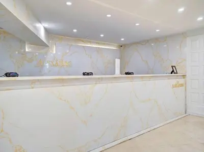 a bar in a room with a marble wall at Cozy Ocean View Condo Beach Service and Pool 808 in Miami Beach