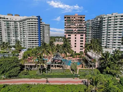 a view of a city with palm trees and buildings at Charming Ocean View Condo Beach Service 516 in Miami Beach