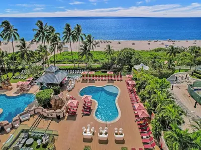 an aerial view of a resort with a pool and the beach at Ocean View Condo Beach Service and Pool 618 in Miami Beach