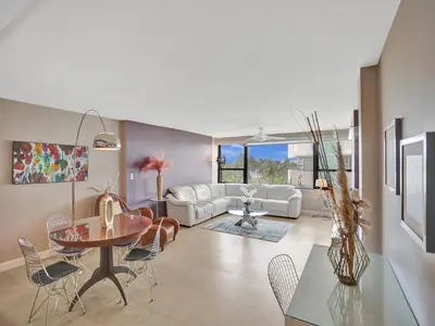 a living room with a table and chairs at Ocean View Condo Beach Service and Pool 618 in Miami Beach