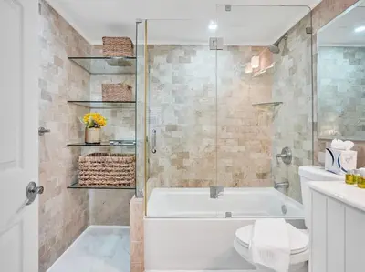a bathroom with a tub and a toilet and a sink at Luxury Beachfront Condo Beach Service 1418 in Miami Beach