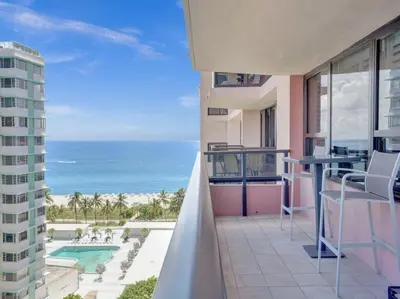 a balcony with a view of the ocean at Luxury Beachfront Condo Beach Service 1418 in Miami Beach