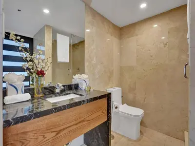 a bathroom with a sink and a toilet at Luxury Ocean View Condo Beach and Resort 1216 in Miami Beach