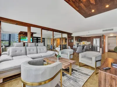 a living room with a couch and chairs and a table at Luxury Full Ocean View Condo Resort Amenities 501 in Miami Beach