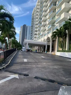 an empty parking lot in front of a large building at Pavilion in Miami Beach