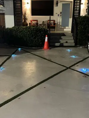 a orange cone on a driveway with blue lights at Luna y Sol Calle 8 in Miami