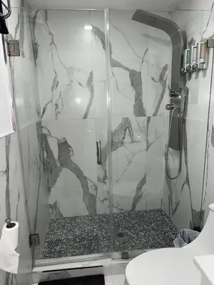 a shower with a glass door in a bathroom at Luna y Sol Calle 8 in Miami