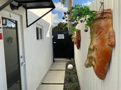 a bagel hanging on the side of a house at Luna y Sol Calle 8 in Miami