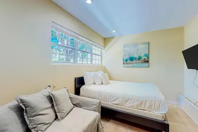 a living room with a bed and a couch at Go with the Flow in Hollywood