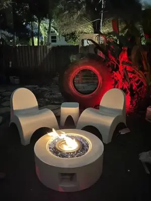 a table with a candle in front of a house at Kiki Grand Suite - Men's Clothing optional Guest Houses in Fort Lauderdale