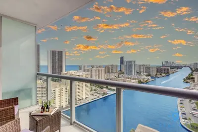 a view of the city from a balcony with a mural at Infinite View Balcony Gym Amaizing Pool in Hallandale Beach