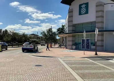 a car parked in front of a building at Stunning Apartment in Downtown Doral in Miami