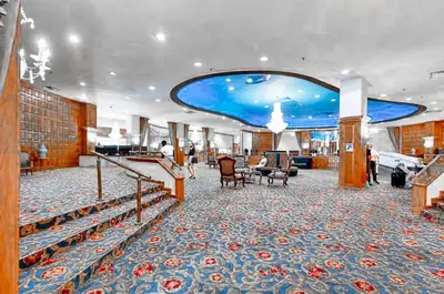 a lobby on a cruise ship with people walking around at Castle 1118 Studio BayView Direct Beach Access, Tennis, Pool, Restaurants, Free Parking in Miami Beach