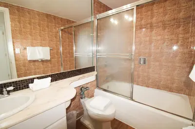 a bathroom with a shower and a toilet and a sink at Castle 1120 Bayview Studio, Beach access, Pool, Tennis, Free parking in Miami Beach