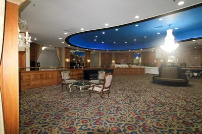 a lobby with chairs and a table in a building at Castle 515 Studio BayView Direct Beach Access, Pool, Tennis, Free Parking in Miami Beach