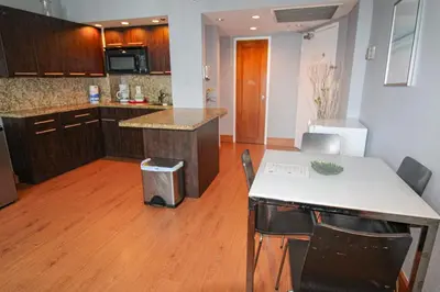 a kitchen with a white table and chairs in a room at Castle 618 in Miami Beach