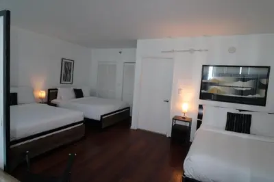 a room with two beds and two lamps in it at Castle B6 in Miami Beach