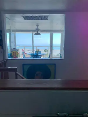 a view of a living room with a view of the beach at Castle BTH2 Stunning Oceanfront Townhouse, Private Beach Access, Private Pool Access, Tennis and Free Parking! in Miami Beach