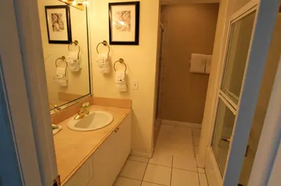 a bathroom with a sink and a mirror at Castle PH15 Spacious Penthouse with Balcony, Beach Access, Pool, Tennis, Free Parking in Miami Beach
