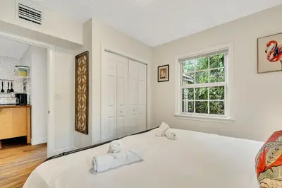 a white bedroom with a bed and a window at Casa Del Rio 4 Bed 2 Bath Next to River 1826 in Miami