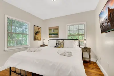 a bedroom with a large white bed with two pillows on it at Casa Del Rio 4 Bed 2 Bath Next to River 1826 in Miami