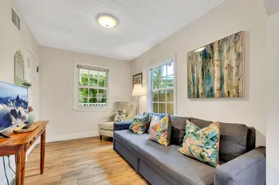 a living room with a couch and a table at Casa Del Rio 4 Bed 2 Bath Next to River 1826 in Miami