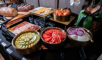 a table topped with bowls of different types of food at Gale Miami Hotel & Residences in Miami