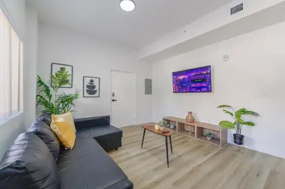 a living room with a couch and a table at Charming Apt Near to Stadium LoanDepot Park in Miami