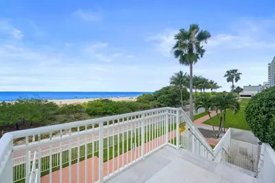 a balcony with a view of the beach at Pavilion Residences on the Beach in Miami Beach