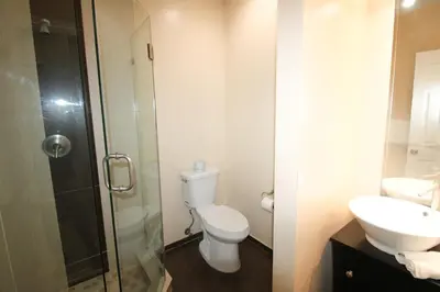 a bathroom with a toilet and a shower and a sink at Castle Ph2 Balcony Oceanfront Condo, Beach Access, Pool, Tennis, Free Parking in Miami Beach